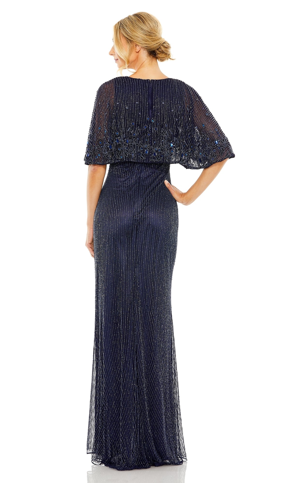Woman in the Mac Duggal 5797 Midnight Blue Beaded Formal Gown—fitted, floor-length with a sheer capelet and elegant updo—shown from the back against white; a stunning mother-of-the-bride choice.
